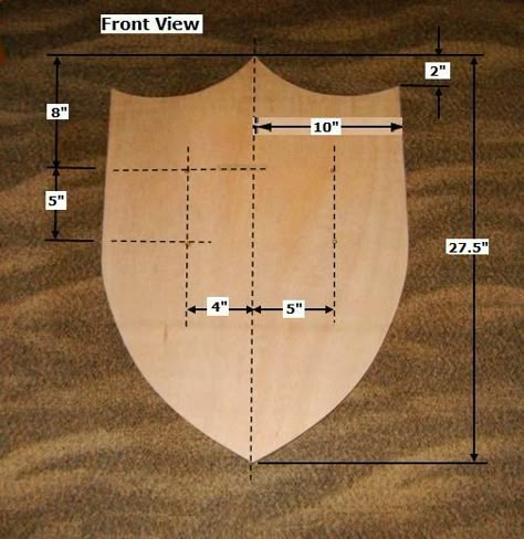 With the right plan, materials, and equipment, you can build this simple Wood Medieval Shield, as shown here. How To Make A Shield, Cardboard Shield, Medieval Shield, Cardboard Costume, Medieval Shields, Wooden Shield, Toy Wood, Chicken House, Cardboard Crafts