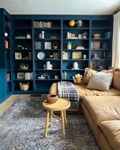 Happy Friday, friends! I realized I never shared photos of the living room library so I decided to jump in on #fridaysareforphotos cause it feels like OG IG days🙌 I clearly need more books😅 but am enjoying decorating with my antique and thrift finds! This room feels almost complete but tell me… do I need to paint the ceiling Hague Blue as well?🧐🤪 #livingroomlibrary #homelibrary #bookshelves #hagueblue #builtinbookshelves Blue Shelving Living Room, Paint The Ceiling, Builtin Bookshelves, Blue Bookshelves, Living Room Library, Dark Blue Living Room, Built In Shelves Living Room, Hague Blue, Farmhouse Office