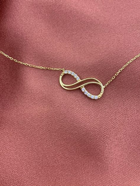 ◾14k Real Solid Gold Infinity Necklace, CZ Infinity Necklace, Minimalist Pandant, Everday Wear, Dainty Gold Jewelry for Women, Gift for Her ❝ ♾The infinity symbol is a symbol that represents eternity and continuity. Gold also symbolizes beauty and wealth beyond time. ❞ By wearing a minimalist eternity, you can reflect your style . ◾Made to order.◾ * Raw Material: 100% 14K Solid Gold * Gold Color selection: Yellow Gold, Rose Gold, White Gold * Pendant Height: 11mm/0.43inch * Pendant Width: 10mm/0 Gold Infinity Necklace, Infinity Necklace Gold, Eternity Necklace, Dainty Gold Jewelry, Unique Pendant Necklace, 14k Yellow Gold Necklace, Infinity Pendant, Dainty Gold Necklace, Luxury Necklace