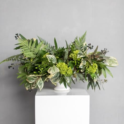 Green Floral Arrangements Centerpieces, Flower Arrangement For Rectangular Table, Small Greenery Arrangements, Low Table Flower Arrangements, All Green Floral Arrangements, Low And Wide Floral Arrangements, Greenery Table Arrangements, Foliage Only Arrangements, Botanical Arrangements