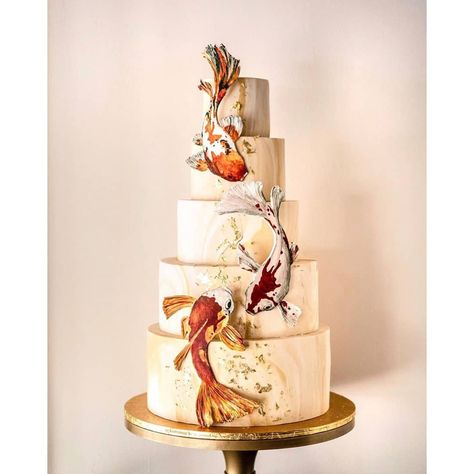 @cake_trends on Instagram: “Probably the grandest 80th Birthday cake. Handmade and hand-painted Koi fishes, marbling texture, 24k gold foil. 28” tall. Definitely…” Koi Fish Cake Design, Koi Fish Cake, Koi Cake, Floral Cake Design, Painting Cake, 80th Birthday Cake, Koi Fishes, Sugar Flowers Cake, Cactus Cake