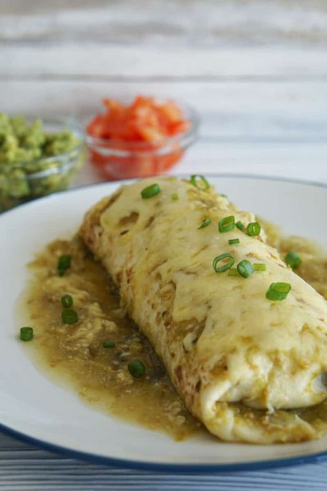 These verde Wet Burritos feature slow-cooked carnitas with spicy Mexican rice and beans and melted cheddar cheese. Chilli Verde Burritos, Wet Burrito Green Sauce Recipe, Chili Verde Pork Burrito, Chili Verde Pork Smothered Burritos, Chili Verde Burritos Recipe, Verde Wet Burrito, Salsa Verde Chicken Burritos, Chile Verde Burrito Recipe, Wet Burrito With Green Sauce