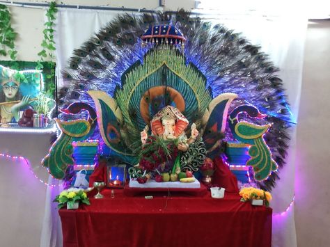 Peacock theme Ganpati decoration at home Peacock Feathers Ganpati Decorations, Peacock Theme Decoration, Floral Decoration Ideas, Ganapathi Decoration, Bappa Decoration, Ganesha Festival, Ganpati Decor, Ganpati Bappa Morya, Ganpati Decoration At Home