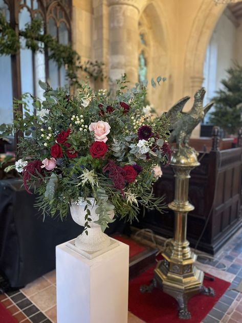 Winter Ceremony Decor, Christmas Church Wedding, Winter Church Wedding, Altar Flowers Wedding, Wedding Pedestal, Wedding Church Aisle, Crimson Wedding, 2026 Wedding, Christmas Wedding Flowers