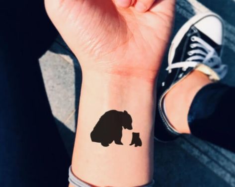 15+ Small Bear Tattoo Designs and Ideas Bear Claw Tattoo Women, Bear Finger Tattoo, Mama Bear Baby Bear Tattoo, Bear Paw Tattoos For Women, Mama Bear Tattoo Mothers, Small Bear Tattoos For Women, Mamma Bear Tattoo, Mom Bear Tattoo, Bear Silhouette Tattoo