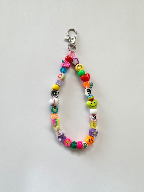 You will receive 1 random mix keychain wristlet/bag charm beaded by me with luuvvvv and will look similar to those pictured <3  Can put a custom name/word in block letters or no personalization at all! ️🌼 Length is measured straight across, design will be 6" in size. Smiley Design, Bead Keychain, Beaded Keychain, Hip Jewelry, Bottle Cap Art, Diy Charm Bracelet, Bracelets Design, Diy Bracelet Designs, Rainbow Beads