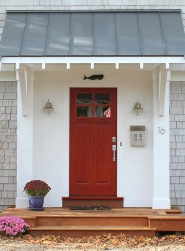 Like the shed roof.  Wouldn't have thought of it for a front door, but looks good in this application. Nautical Front Door Decor, Nautical Front Door, Front Door Overhang, Porch Overhang, Front Door Awning, Door Overhang, Red Front Door, Porch Roof, Door Awnings