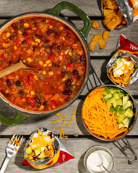 One-pot camping chili is a hearty meal that is easy to make and doesn’t take much to prepare for ahead of time. Camping Chili, Bean Salsa, Vegan Sour Cream, Candy Treats, Fire Cooking, Campfire Cooking, Hearty Meal, Corn Chips, Camp Fire