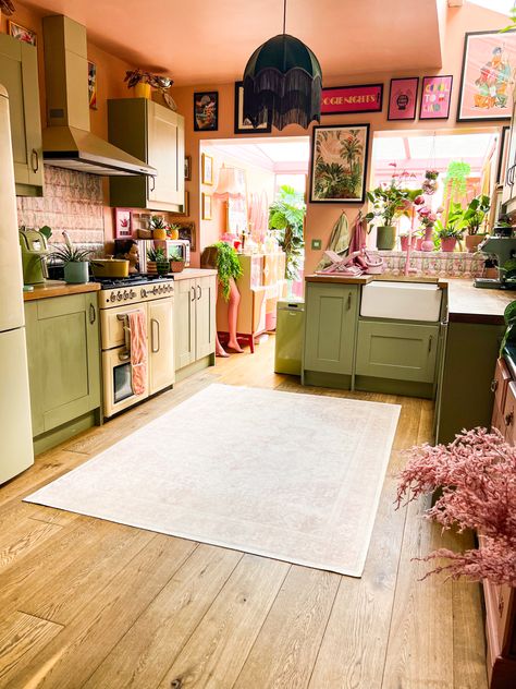 Pink and green. Kitchen. Maximalist interiors. Quirky. Eclectic home. Subtle Pink Accents, Green Cabinets Pink Walls, Green Kitchen Cabinets Pink Walls, Pink Yellow White Green Bedroom, Pink Painted Kitchen Walls, Cottagecore Pink Kitchen, 70s Pink Kitchen, Green And Coral Kitchen, Sage Green And Blush Kitchen