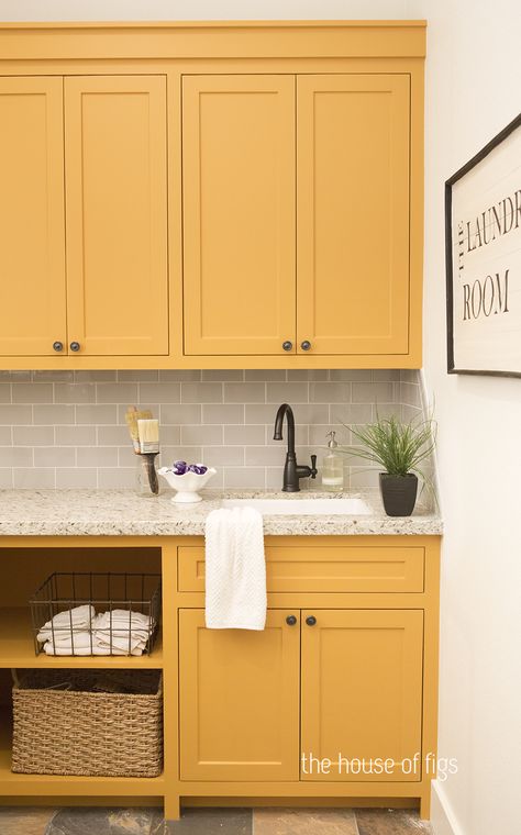 Sunshine delivered! These pretty yellow cabinets in this laundry room will make you smile on laundry day. Yellow Laundry Room Cabinets, Yellow Cabinets Laundry Room, Mustard Laundry Room, Yellow Utility Room, Yellow Bathroom Cabinets, Yellow Laundry Room Ideas, Laundry Room Yellow, Yellow Laundry Room, Yellow Laundry