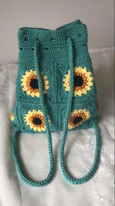 Crochet sunflower drawstring backpack! #shortsI have patterns available at the following places:Ko-fi: https://ko-fi.com/alyssiacreatesRavelry: https://www.r... Backpack Free, Crochet Sunflower, Crochet Stuff, Square Bag, Drawstring Backpack, Free Pattern, Sunflower, Backpacks, Square