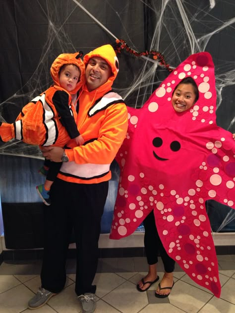 Finding Nemo Halloween costumes!   #findingnemo #nemo #marlin #peach #starfish #family Finding Nemo Family Costume, Nemo Group Costumes, Finding Nemo Costume Family, Gill Finding Nemo Costume, Finding Nemo Halloween Costume Family, Finding Nemo Group Costume, Family Nemo Costumes, Nemo Halloween Costumes, Starfish Costume Diy