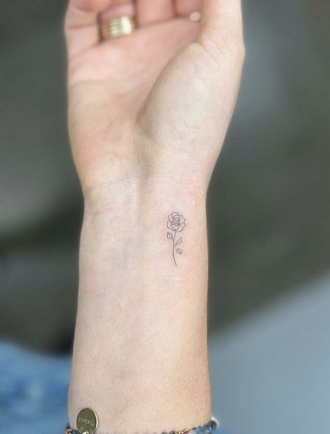 Tiny Rose Hand Tattoo, Rose Tattoo Small Wrist, Fine Line Flower Wrist Tattoo, Runuculous Flower Tattoo, Rose Initial Tattoo, Tiny Rose Tattoo Wrist, Small Fine Line Rose Tattoo, Small Tattoo For Daughter, Tiny Tattoo Flower