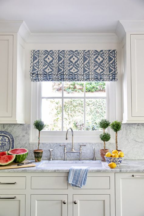 2021 Decor and Design Trends I Love: Beautiful blue and white kitchen idea with topiaries and custom Roman window shade - Clary Bosbyshell Clary Bosbyshell, Roman Shades Kitchen, Kitchen Window Coverings, Over Kitchen Sink, Window Over Sink, Kitchen Window Valances, Kitchen Sink Window, Over Sink, Kitchen Valances