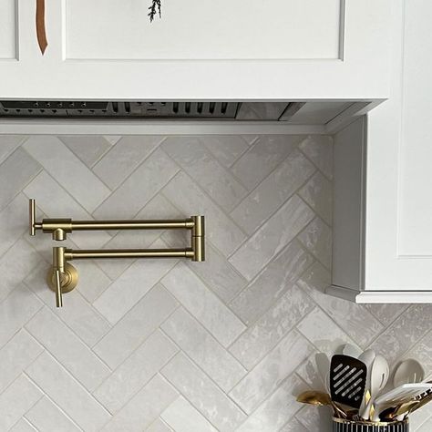 Emilia Aquino | Always Stylish Home on Instagram: "My backsplash tile is on SALE today! Comment SHOP for a direct link! If you’ve been thinking about this tile, I would grab it now! It’s the lowest price I’ve seen it at all year! My pot filler and a bunch of other items in my home are also on sale so I have those linked as well! Backsplash details: My tile is @bedrosians Cloe 2.5” x 8” Ceramic Tile in White. The grout is Prism Arctic White. The pattern is herringbone. Ways to SHOP: ~ Comment SHOP below for a direct link sent to your DM ~ Click the link in my bio & select the “Shop My Home on LTK” or “Amazon Storefront” tab ~ Always check my stories throughout the day for new finds and daily deals! Check out my stories throughout the day for new finds and daily deals! ✨Follow @always Kitchen Backsplash Herringbone Pattern, Off White Herringbone Backsplash, Cloe Tile Backsplash Kitchen, Cloe Tile Herringbone Backsplash, Kitchen Tiles Herringbone, Cloe Tile Herringbone, Backsplash Behind Range Hood, White Splashback Tiles, Subway Herringbone Backsplash