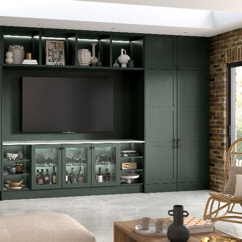 Custom built media wall featuring glazed doors, decorative shelving and a custom built home office. Green Entertainment Unit, Hidden Home Office, Green Shaker Kitchen, Trendy Paint Colors, Kitchen Examples, Shaker Style Furniture, Traditional Style Kitchen, Storage Solutions Bedroom, Decorative Shelving