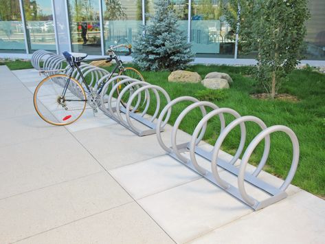 Maglin's 350 Series Bike Rack is classic yet durable providing functionality to your space. The bike rack is constructed with steel and is available in 4 or 5 rings. #Maglin #MaglinSiteFurniture #SiteFurniture #StreetFurniture #SiteFurnishings #PublicFurniture #BicycleParking #BikeRack #Bicycle #LandArch #Architecture #UrbanDesign #LandscapeArchitecture Bicycle Rack Design, Bike Parking Design, Bicycle Parking Design, Standing Bike Rack, Steel Stairs, Concrete Architecture, Bicycle Storage, Bicycle Rack, The 300