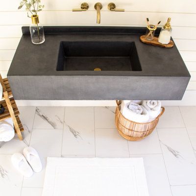 A wall-hanging bathroom vanity with metal bracing and 9'', 100% glass fiber reinforced concrete top. The integrated sink and two-part sealer make for easy clean-up and lifelong durability. Also includes integrated 2'' backsplash. Our box style sink fits any standard drain and a plumbing nut is attached to the underside for easy plumbing hook-up. Brackets are included and mount to wall studs; hardware for mounting is included and any construction adhesive will firmly attach concrete top to bracke Concrete Shower Pan, Concrete Bathroom Vanity, Concrete Vanity Top, Vanity With Backsplash, Concrete Shower, Concrete Vanity, Powder Room Sink, Floating Sink, Concrete Bathroom