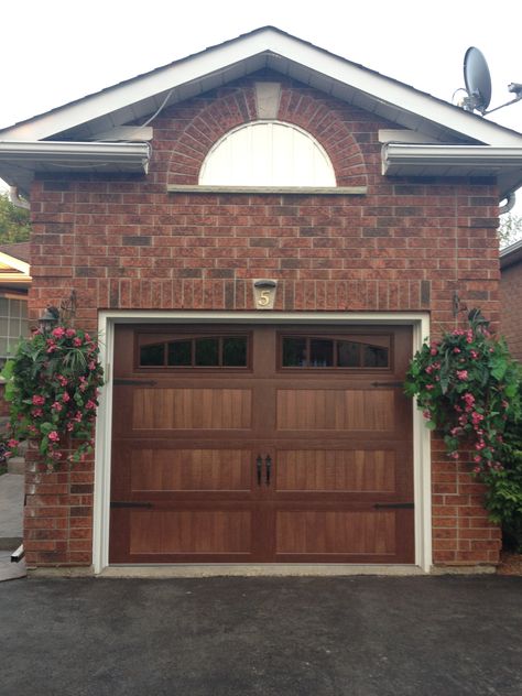 @C.H.I. Overhead Doors Accents Faux Wood Carriage House Garage Door Wood Garage Doors Red Brick House, Garage Doors On Brick House, Brick House Wood Garage Door, Wood Garage Doors Brick House, Garage Door Red Brick House, Brick House Garage Door, Wood Look Garage Doors, Brown Garage Doors, Garage And Front Door