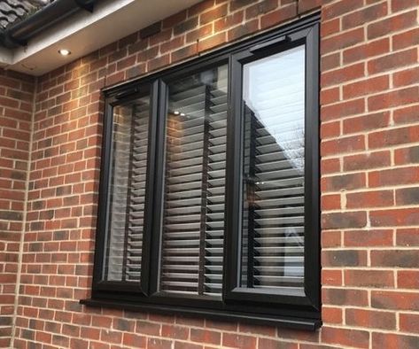 Black UPVC window with three panes and blinds inside Upvc Window Design Modern, Black Upvc Windows, Upvc Sliding Windows, Upvc Porches, Upvc Casement Windows, Coloured Upvc Windows, Upvc Sliding Doors, Flush Upvc Casement Windows, Upvc Sash Windows