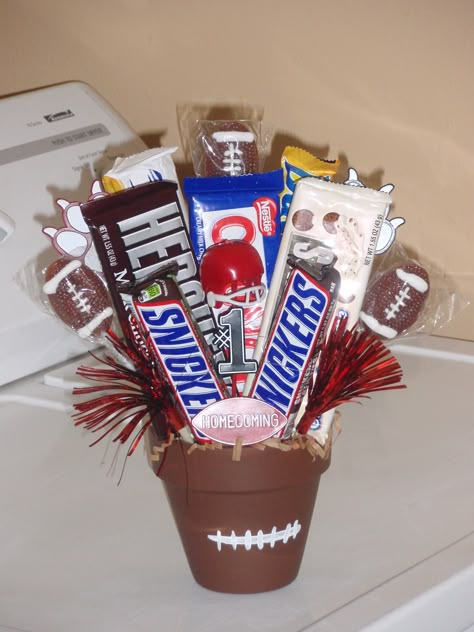 Made this for a football player on Homecoming! Gifts For Football Players From Cheerleaders, Homecoming Baskets For Football Players, Gift For Football Players From Cheerleaders, Football Buddy Basket, Spirit Gifts For Football Players, Homecoming Gifts, Football Centerpiece, Personalized Football Gifts For Players, Football Candy