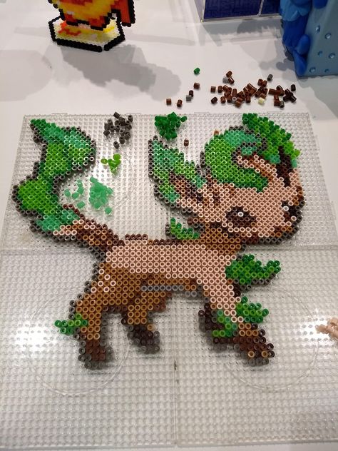 4 hour Eevee Leafeon evolution with perler beads Eevee Evolutions Perler Beads, Eevee Perler Bead Patterns, Eevee Perler, Mewtwo Pokemon, Pokemon Pearl, Hama Beads Pokemon, Pokemon Perler, Pokemon Eevee Evolutions, Pixel Art Pokemon