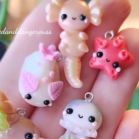 CharmedandDangerous | Handmade Clay Miniatures on Instagram: "New items will be available shortly, along with donut of the month.(7pmcst) Have a wonderful night and weekend, everyone! Thank you for all the love this week on my posts and in dms. I'm so grateful 🩷 #knittingcharms #crochetallthethings  . . . . . . . #knittingfriends #makerscommunity #knittingtools #knittingneeds #makeart #seaslug #jellyfish #axolotl #narwhals" Jelly Fish Clay, Clay Jellyfish, Have A Wonderful Night, Cute Jellyfish, Clay Diy Projects, Sea Slug, Knitting Tools, Clay Miniatures, My Posts