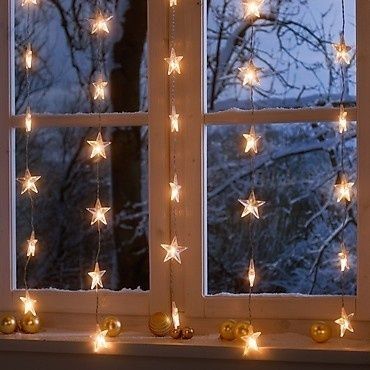 Dishfunctional Designs: A Colorful Bohemian Glow in Winter Fairy Lights Ikea, Christmas Window Decoration, Starry String Lights, Winter Living Room, Minimalist Candles, Bohemian Christmas, Starry Lights, Winter Window, Christmas Window Decorations