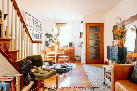 White tulip table is seen in view of dining area from living room. Philadelphia Row Home Interior Design, Rowhome Interior Design, Rowhome Living Room, Row Home Interior Design, Philly Rowhome, Kallax Shelving, Row Home, Kallax Shelving Unit, Cube Storage Shelves