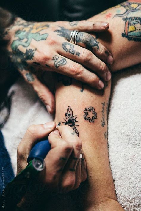 Tattoo Artist Tattooing A Womans Arm" by Stocksy Contributor "Kkgas Getting Tattooed Photography, Get A Tattoo Aesthetic, Doing Tattoo Aesthetic, New Tattoo Aesthetic, Tattoo Shop Pictures, Tattoo Artist Working, Tattoos Vision Board, Tattoo Shop Photoshoot, Tattoo Photography Ideas