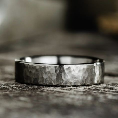 Discovered by American astronomer Scott Sheppard, Arche, a marvelous moon circling Jupiter inspired the design of this sleek, hammered titanium band. Our skilled artisans meticulously craft a unique moon-like hammered texture into each titanium ring. The ultra-durable, lightweight and hypoallergenic composition of titanium paired with a signature hammered finish, makes this wedding band an ideal choice for a timeless look and everyday wear. 6mm Titanium Hammered Ring Features:  Lightweight, dura Dark Titanium Wedding Band, Wedding Rings Masculine, No Stone Wedding Band, Simple Male Wedding Bands, Woven Wedding Rings, Men’s Silver Ring Design, Simple Mens Rings, Wooden Mens Wedding Bands, Mens Titanium Ring