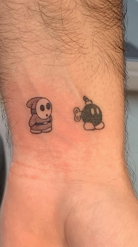 Shy Guy Mario Tattoo, Shy Guy Tattoo Design, Mario Matching Tattoos, Small Tattoos Cartoon, Bob Omb Tattoo, Shy Guy Drawing, Shy Guy Tattoo, Rapper Tattoos Ideas, Doodle Bob Tattoo