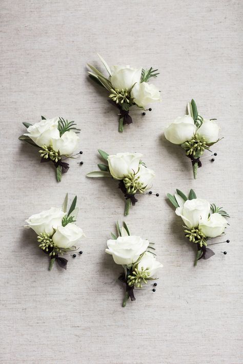 White And Green Buttonholes Grooms, White Green Buttonhole, Classic White Boutonniere, Sage Green And White Boutonniere, Greenery Wedding Boutineers, White Boutineer Wedding, Green And White Boutonniere, White Spray Rose Boutonniere, White And Green Boutonniere