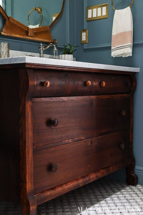 Want to turn a dresser into a vanity? Find out how to convert a vintage dresser into a bathroom vanity with this step by step tutorial! #diy #bathroominspo Dresser Sink, Basement Powder Room, Cottage Bathroom Inspiration, Wallpaper Bookcase, Painted Shower Tile, Marble Top Dresser, Dresser Vanity Bathroom, Bathroom Restoration, Vintage Bathroom Vanity