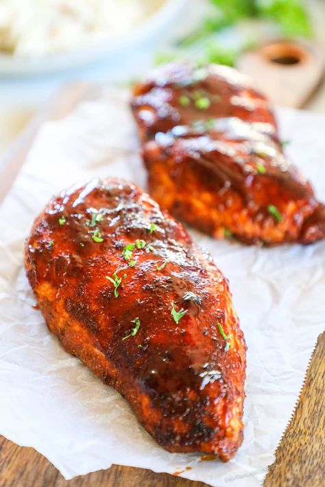 This 30 Minute Baked BBQ Chicken Breast is a summer recipe you can enjoy all year long! The chicken is slathered in a sweet, smoky, savory spice blend, covered in BBQ sauce, then baked until tender and juicy. Serve this Oven-Baked BBQ Chicken with any of your favorite summer side dishes. It's a meal that the whole family will love that takes just 5 minutes to prep. Serve this BBQ Oven Baked Chicken as is or shred it up and use it in another recipe! Oven Baked Bbq Chicken Breast, Oven Bbq Chicken Breast, Baked Bbq Chicken Breast, Bbq Baked Chicken Breast, Baked Bbq Chicken Recipes, Bbq Chicken Breast Recipe, Oven Bbq Chicken, Oven Baked Bbq Chicken, Easy Bbq Sauce