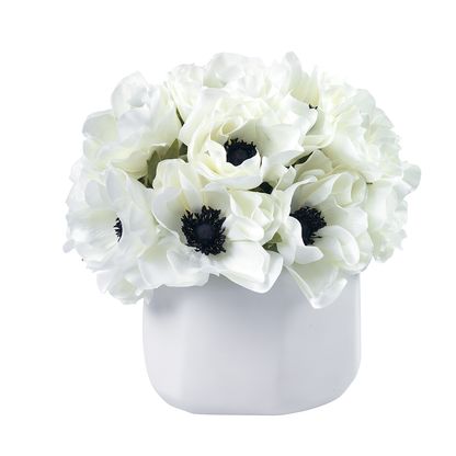 This bouquet of creamy white anemones inspired by Ashley Stark, the Creative Director of STARK Carpet and contemporary taste-maker, adds a fresh and stylish touch to any room. The faux blooms are presented in an organic matte ceramic vase with illusion water and are the perfect decorative accent for a coffee or side table.  Overall Dimensions: 10" long x 9" wide x 10" tall Composed of: anemones; matte ceramic vase Ashley Stark, White Anemones, Stark Carpet, White Anemone, Matte Ceramic, Gift Bouquet, White Vase, White Vases, Plant Gifts