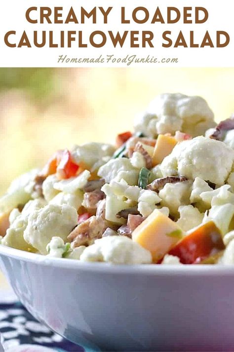 Cauliflower Pepper Bacon Salad is an addicting, low carb, combination of delicious flavors. Cauliflower, bacon, cheese, peppers and onions all combined with a creamy sauce. This salad Absolutely needs to go to your next potluck, game day party or Holiday celebration. This salad is a popular side dish at any event. #salad #sidedish #cauliflowerrecipe #lowcarb #glutenfree #healthyholidayrecipe #healthyside #partyfood Pepper Bacon, Salad Recipes Low Carb, Party Side Dishes, Pepper Salad, Popular Side Dishes, Easy Cauliflower, Healthy Holiday Recipes, Bacon Salad, Game Day Party