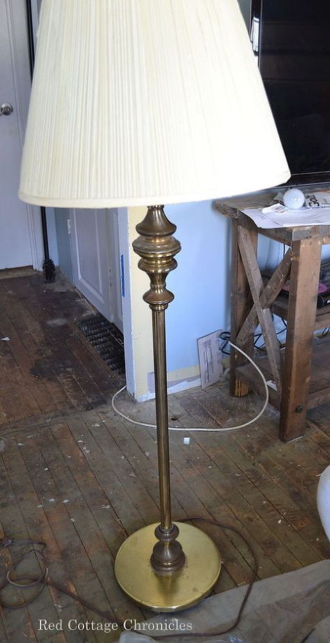 When I participated in the One Room Challenge, I was looking for a new floor lamp to tie into my casual coastal feel.  I didn't have to look too far! My Aunt was relocating from her home to a retirement apartment and she had this old brass lamp with a cream colored pleated shade.  The brass was showing its age and was dull and uninteresting. I had an old burlap shade I had actually put in the garbage pile!  I pulled it out, taped off some stripes and painted them in with some blue craft ... Floor Lamp Redo, Floor Lamp Makeover, Lamp Redo, Diy Floor Lamp, Garden Diy Ideas, Furniture Redos, Lamp Makeover, Concrete Lamp, Pottery Barn Inspired