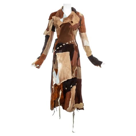 For Sale on 1stDibs - Dolce & Gabbana goat hide and leather patchwork coat with wrap fastening on the waist, raw edges and leather blanket stitches and tassels throughout. Fall-Winter Upcycled Coat, Patchwork Leather Jacket, Wool Maxi Coat, Dream Wishlist, Patchwork Coat, Upcycle Clothes Diy, Dream Fashion, Leopard Print Coat, Designer Coats