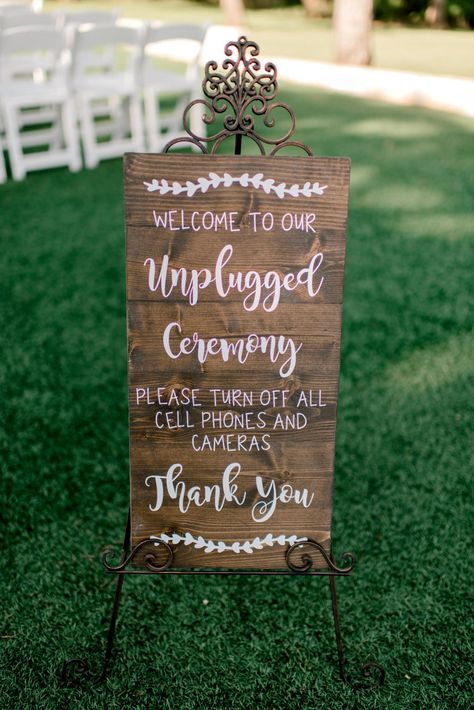 | unplugged ceremony wedding sign | wedding ceremony sign ideas | natural wood wedding signs | "welcome to our unplugged ceremony. please turn off all cell phones and cameras.  thank you" | ways to enforce no phones during wedding ceremony | natural + elegant wedding decor | outdoor wedding decorations | photo taken at THE SPRINGS Event Venue. follow this pin to our website for more information, or to book your free tour! SPRINGS location:  The Ranch in Denton, TX photographer:  Wiler Weddings Ranch Style Weddings, Ceremony Decorations Outdoor, Wedding Ceremony Decorations Outdoor, Romantic Outdoor Wedding, Wedding Ceremony Signs, Outdoor Wedding Photography, Unplugged Wedding, Wood Wedding Signs, Ceremony Signs