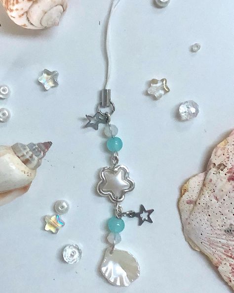 new design up now 🐚🌊 (link in bio😼) - - - - #sea #seashell #starfish #siren #sirencore #ocean #oceancore #seacore #pearljewelry #beadedkeychain #aestheticphonecharm #beadedjewelry #phonecharm #mermaidaesthetic #silverjewelry #pearl #staraesthetic #beach #summerjewelry Ocean Clothes, Sea Core, Mermaidcore Aesthetic, Cord Keychain, Beads Lanyard, Beach Keychain, Phone Keychain, Keychain Blue, Jewels Diy