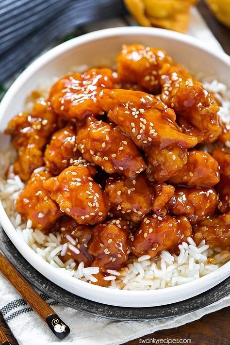 Sweet and sour chicken in a bowl with white rice. Tender pieces of lightly pan fried chicken tenders coated in glaze and garnished with sesame seeds. Pan Fried Chicken Tenders, Fried Chicken Tenders, Sweet And Sour Chicken, Sweet Sour Chicken, Pan Fried Chicken, Easy Chinese Recipes, Sweet N Sour Chicken, Chicken Salad Sandwich, Sweet And Sour Sauce