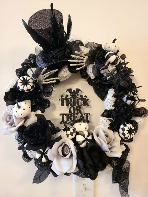 Happy Halloween Black and White Trick or Treat Wreath, embellished with balack and and white roses, pumpkins and spiders. Topped off with 2 skeletons hands adjusting the top hat! Black And White Halloween Wreath, White Halloween Wreath, 2 Skeletons, Gothic Wreath, White Wreaths, Halloween Farm, Halloween Black And White, Black Halloween Wreath, Halloween Door Wreaths