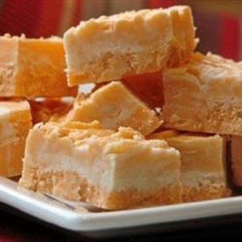 Orange Cream Fudge | "This recipe is extremely easy and very tasty." #recipe #christmas Orange Cream Fudge, Cream Fudge Recipe, Irish Cream Truffles, Best Fudge Recipe, Cinnamon Rolls From Scratch, Cream Fudge, Walnut Fudge, Christmas Fudge, Caramel Fudge