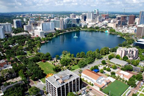 Lake Eola Park, Downtown Orlando Lake Eola Orlando, Orlando Skyline, Universal Parks, Lake Eola, Orlando Theme Parks, Family Vacation Spots, Orlando Parks, Kissimmee Florida, Disneyland Pictures