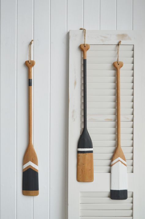 Decorative paddles / oars - Coastal and Beach House Decor... Furniture and Accessories Decorative Paddles, Captains Wheel, Paddle Decor, New England Furniture, Nautical Interior, White Lighthouse, Coastal Beach House, Striped Cushions, Coastal Furniture