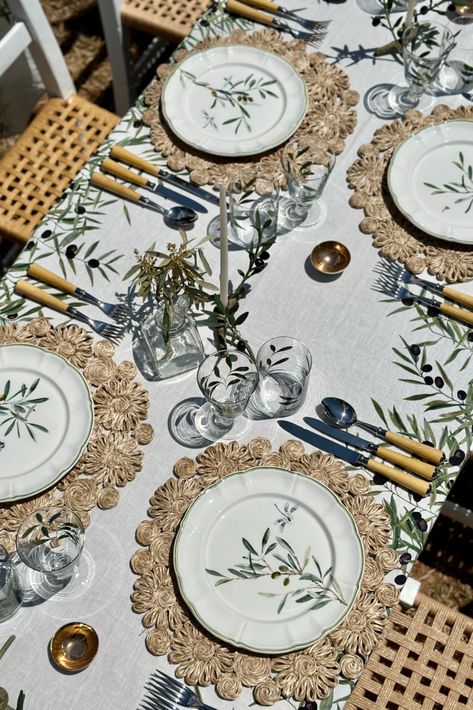 One for the Meditarranean soiree nights. Olive branches, full and fruitful, fall around the edges of this design, in lush and leafy shades of green. A timeless look for the table, that will look fresh season after season. Since antiquity, the olive tree has offered generously to cuisine, wellbeing and healing and continues to do so. This design will frame many happy moments and meals alfresco for the summers now and to come. Mediterranean Table Setting, Summer Tablecloth, Mediterranean Table, Handblown Glassware, Olive Branches, Table Setting Inspiration, Italian Pottery, Green A, Summer Linen