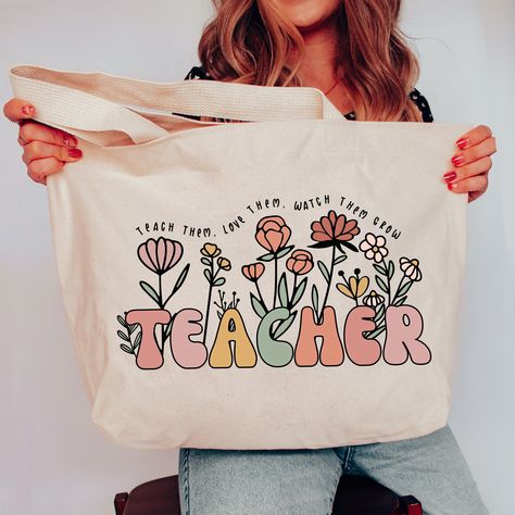 Teacher Tote Bag, Teacher Bag, Personalized Teacher Gift, Custom Tote Bag, Christmas Gift for Teacher Appreciation SHOP TEACHER GIFTS HERE: https://etsy.me/3M5a8Vj * 20"W x 15"H x 5"D * 100% heavy cotton canvas * Large main compartment with zippered closure * Inside zippered flap pouch pocket Shop with Confidence! We are a 5-Star Rated Shop operating since 2015! SHIPPING: We have the fastest handmade Production time! Most items ship within 1-3 days (see each listing's "Estimated arrival" section Teachers Day Gift Ideas Products, Teacher Bags Tote, Teacher Tote Bag Ideas, First Day Of School Teacher Gifts, Free Teacher Appreciation Gifts, Teacher Canvas Bag, Customized Tote Bags, Teacher Tote Bag Gift, Handmade Teacher Gifts