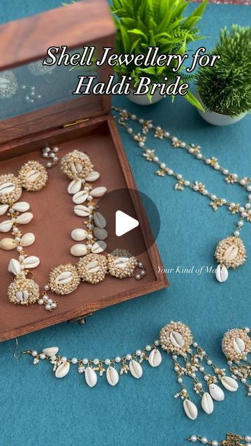 YOUR KIND OF MART • Wedding & Favours • on Instagram: "Shell Jewellery ✨

Includes: 
Hand accessories 
Maangtika with Sheeshpatti 
Neckpiece and 
Medium Earrings with Kaanchain 
.
DM to book 🌻📲
.
Worldwide Shipping 🌍
#reels #reelsinstagram #trending #handmadejewellery #shelljewellery #bridetobe #haldijewellery #haldibride 

[ Haldi Jewellery, Shell Jewellery, Haldi Bride ]" Kaudi Shell Jewellery For Haldi, Shell Jewellery For Haldi, Haldi Jwellary For Bride Unique, Haldi Accessories For Bride, Haldi Earrings, Jewellery For Haldi, Haldi Jewellery For Bride, Shell Jewellery, Hand Accessories