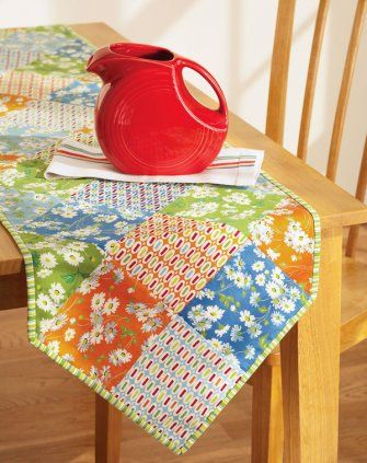 Setting a stylish table is easy with this colorful runner. Rows of six-inch squares set on point come together fast for dynamic effect. This table runner is so easy you’ll want one for every season. Sunflower Table Runner, Quilted Table Runners Patterns, Quilted Table Toppers, Floral Table Runner, Table Runner Pattern, Table Runner And Placemats, Quilted Table Runners, Quilting Patterns, Free Quilting